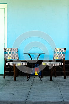 Colorful chairs with table outside