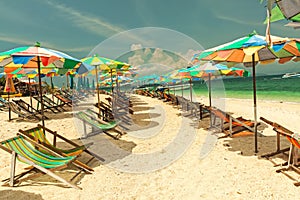 Colorful chairs and umbrella on tropical beach at Koh Khai Nok Island.Phuket Province.Thailand