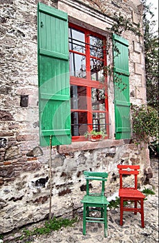 Colorful chairs and window photo
