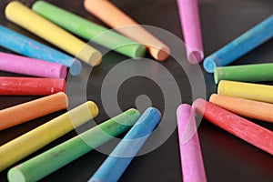 Colorful Chalks On Blank Blackboard