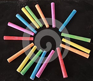 Colorful Chalks On Blank Blackboard