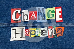Colorful CHANGE HAPPENS word collage from cut out tee shirt letters on denim