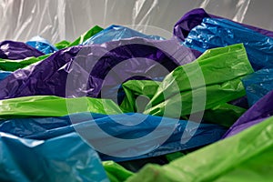 Colorful cheap plastic bags being intertwined together on camera