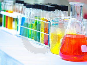Colorful chemical substance in the clear test tube and flask