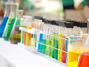 Colorful chemical substance in the clear test tube and flask