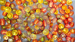 Colorful cherry tomatoes cut in half, different varieties