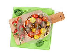 Colorful cherry tomatoes on cutting board