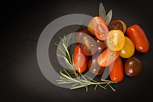 Colorful cherry tomatoes with herbs