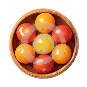 Colorful cherry tomatoes, ready to eat cocktail tomatoes, in wooden bowl