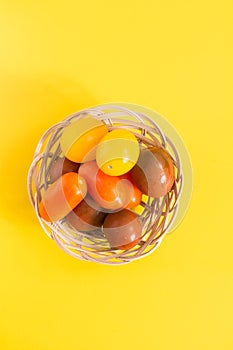 Colorful cherry tomatoes in wicker basket