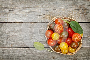 Colorful cherry tomatoes on wooden table