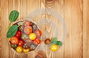 Colorful cherry tomatoes on wooden table