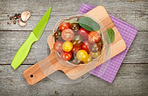 Colorful cherry tomatoes on wooden table