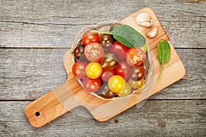 Colorful cherry tomatoes on wooden table