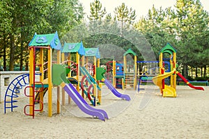 Colorful children playground activities in public park. Safe modern children`s playground