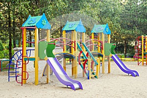 Colorful children playground activities in public park. Safe modern children`s playground