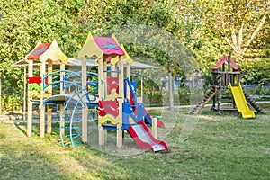 Colorful children playground activities in public park. Safe modern children`s playground