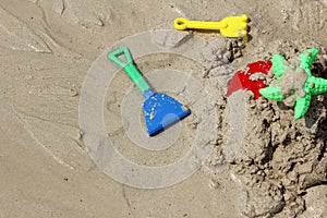 Colorful Children's beach toys on sand