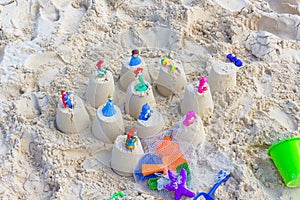 Colorful children s sand toys ready to pack for a seaside holiday, summer vacation at the beach.