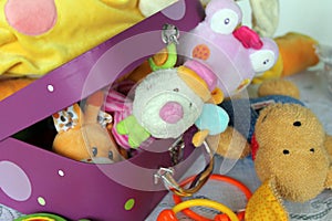 Colorful children's toys in suitcase