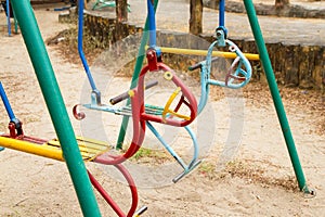 Colorful children swing in playground.Toys for children