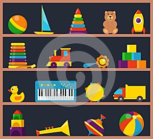 Colorful children toys on wooden shelves. Cubes, whirligig, duck, ball rattle, truck, pyramid, pipe, bear, ball, rocket,
