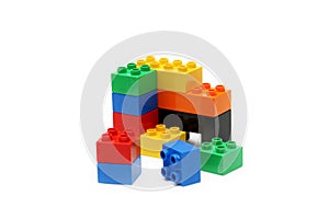 Colorful childrens building blocks with white background photo