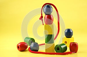 Colorful Childs Wooden Beads with String photo