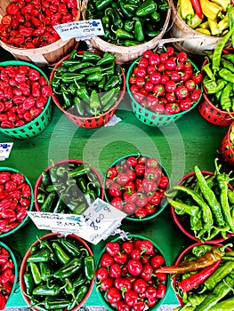 Colorful chili peppers at a farmer`s market stand