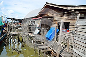 Colorful chinese fishing boat resting at a Chinese Fishing Village- Sekinchan, Malaysia