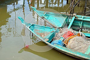 Colorful chinese fishing boat resting at a Chinese Fishing Village- Sekinchan, Malaysia