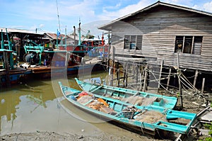 Colorful chinese fishing boat resting at a Chinese Fishing Village- Sekinchan, Malaysia