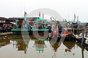 Colorful chinese fishing boat resting at a Chinese Fishing Village, Sekinchan, Malaysia