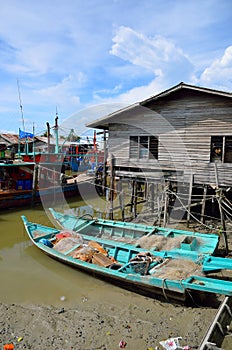 Colorful chinese fishing boat resting at a Chinese Fishing Village- Sekinchan, Malaysia