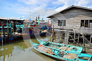 Colorful chinese fishing boat resting at a Chinese Fishing Village- Sekinchan, Malaysia