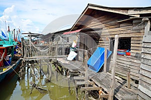 Colorful chinese fishing boat resting at a Chinese Fishing Village- Sekinchan, Malaysia