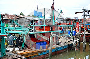 Colorful chinese fishing boat resting at a Chinese Fishing Village- Sekinchan, Malaysia