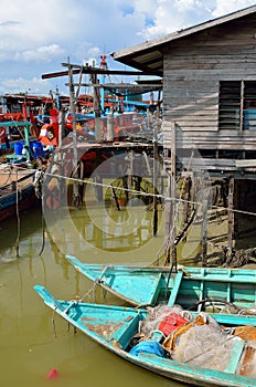 Colorful chinese fishing boat resting at a Chinese Fishing Village- Sekinchan, Malaysia