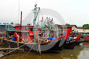 Colorful chinese fishing boat resting at a Chinese Fishing Village, Sekinchan, Malaysia