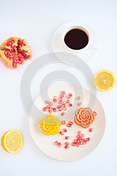 Colorful Chinese mooncakes and coffee with white background