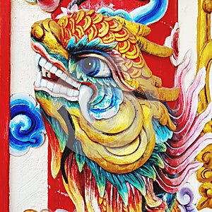 Colorful Chinese sculpture art on wall
