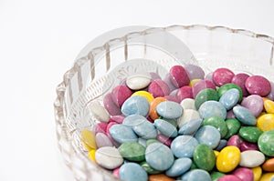 Colorful chocolate candies in a crystal bowl