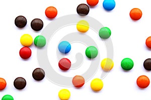 Colorful chocolate candies on white background, small candy mix