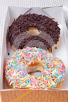 Colorful and chocolate Donut in a box