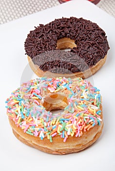 Colorful and chocolate Donut in white plate