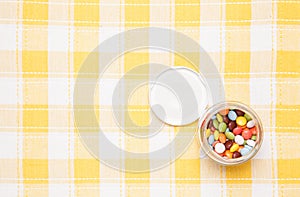 Colorful chocolate was placed in a glass bottle