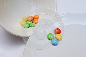 Colorful of chocolate on white plate