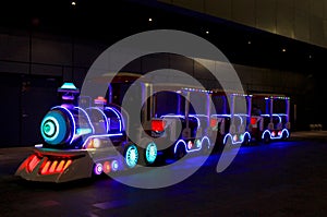 Colorful Choo Choo Train outside a shopping mall photo