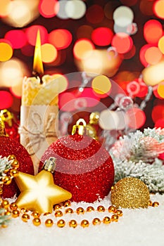 Colorful Christmas Background. Xmas composition with candle, green fir branch, red and gold New Year decoration