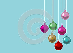 Colorful Christmas ball ornament hanging on blue background. picture copy space for art work design ad or add text message. Holida